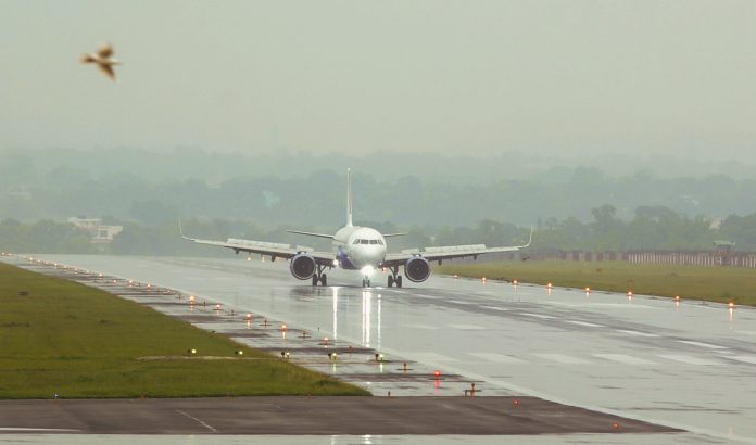 Weather: A flight lands during rain in Ranchi