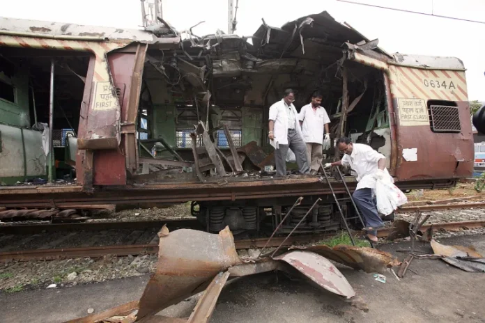 2006-Mumbai-Serial-Train-Blasts-Indian-Forensic-Experts-Collect-Samples-From-A-Damaged-Coach-At-The-Site-Of-A-Bomb-Blast-In-Kandivli-Mumbai-On-12-July-2006-768x512 (1).webp