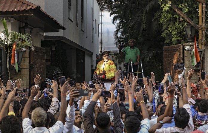 Bollywood actor Amitabh Bachchan greets fans