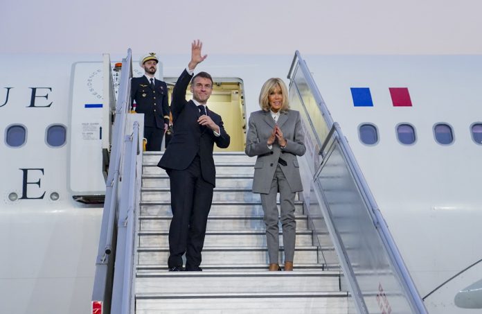 French President Emmanuel Macron departs from India