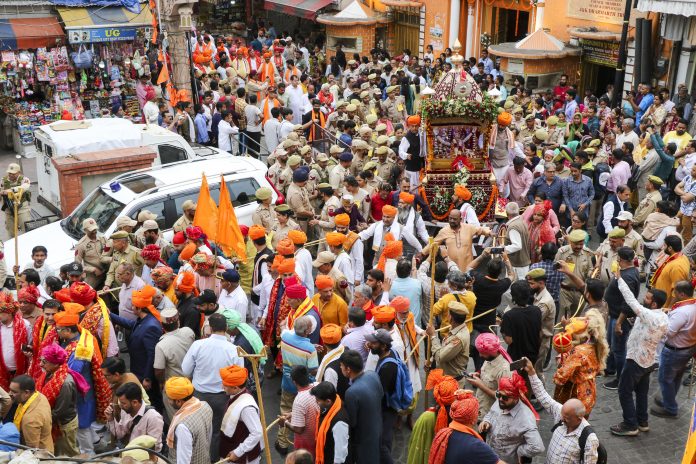 People take part in Shobha Yatra procession