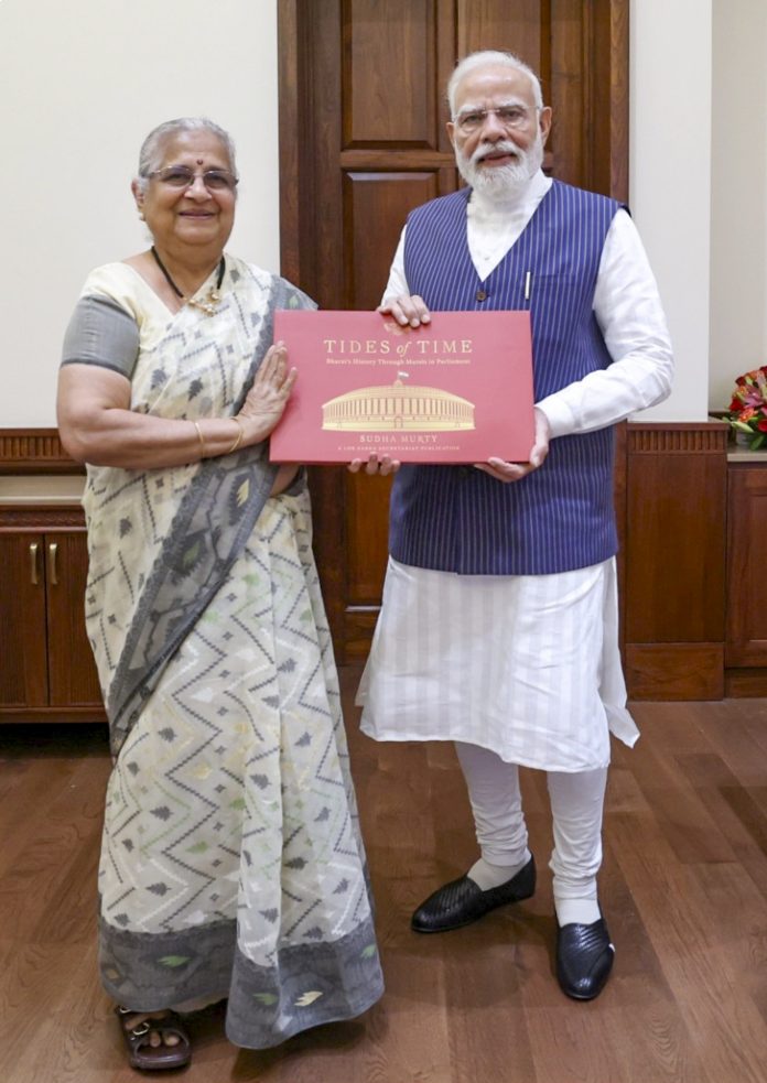 PM Modi receives a book by Sudha Murty